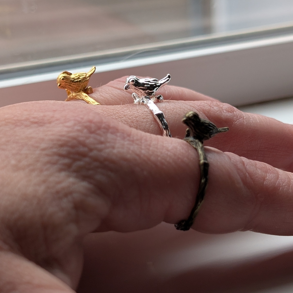 Gold, Silver, and Black Bird Rings